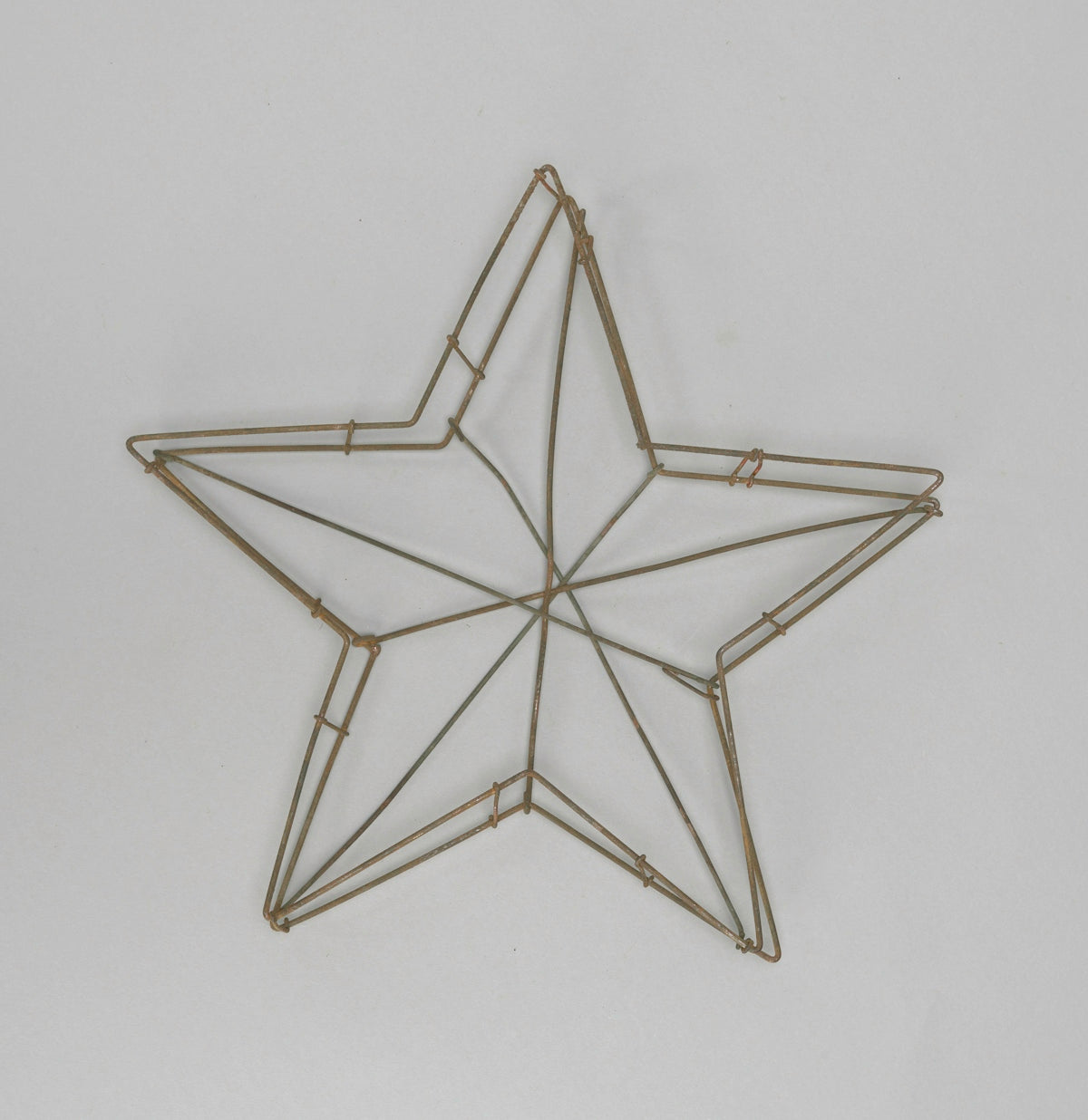 A wireframe star decoration on a white background